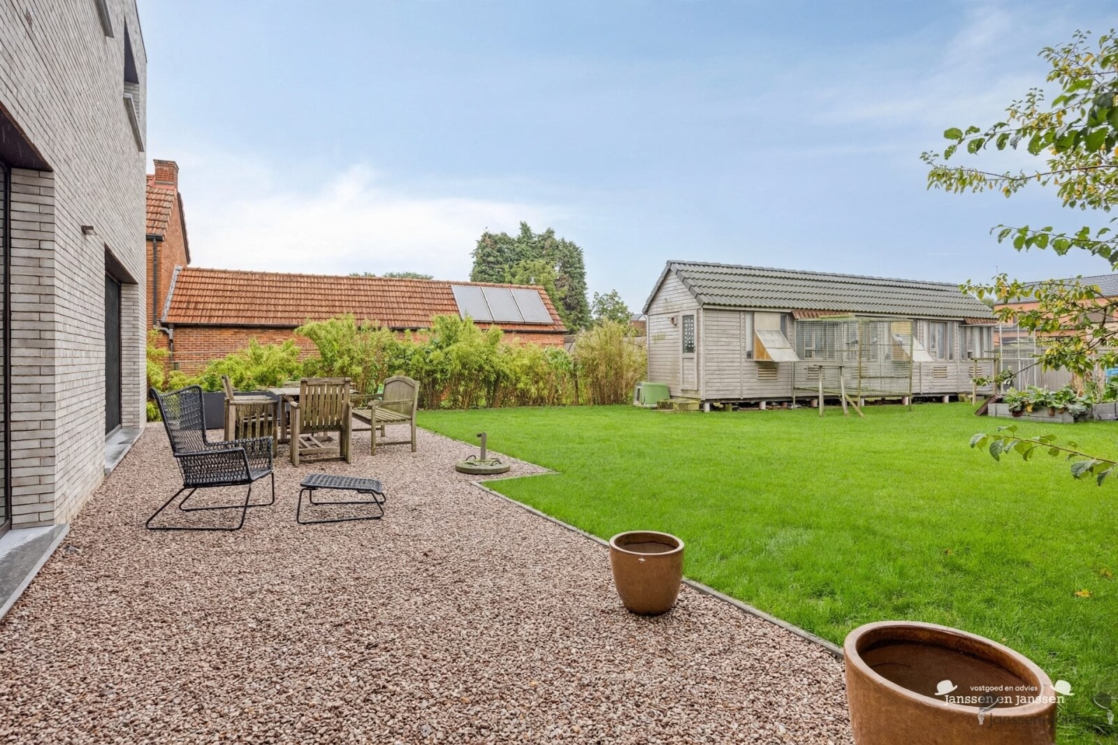 backyard-with-gravel-terrace-and-garden-shed